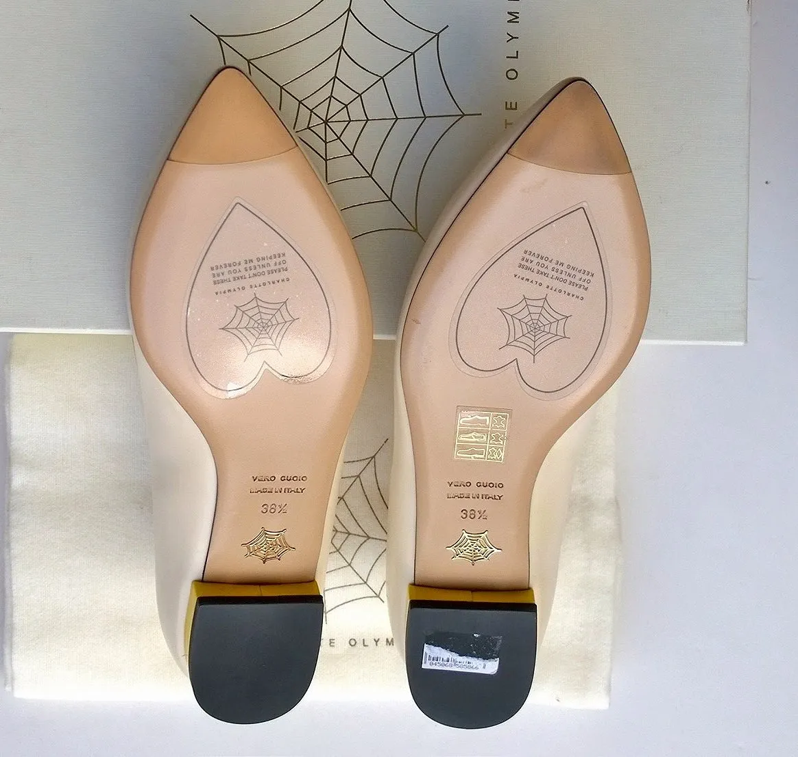 Charlotte Olympia Mid Century Kitty Cream flats with yellow heel and red accent